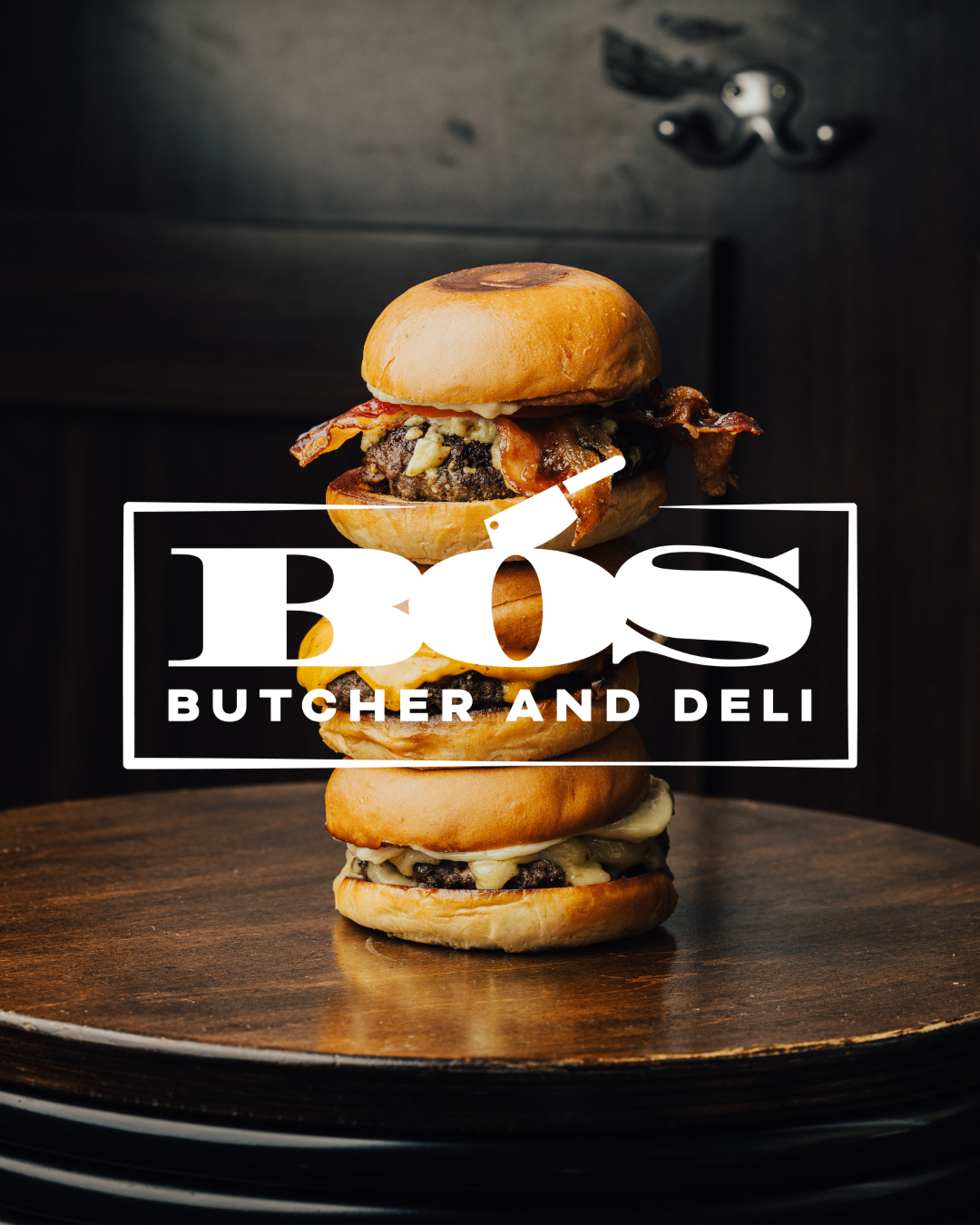 a stack of burgers on a table