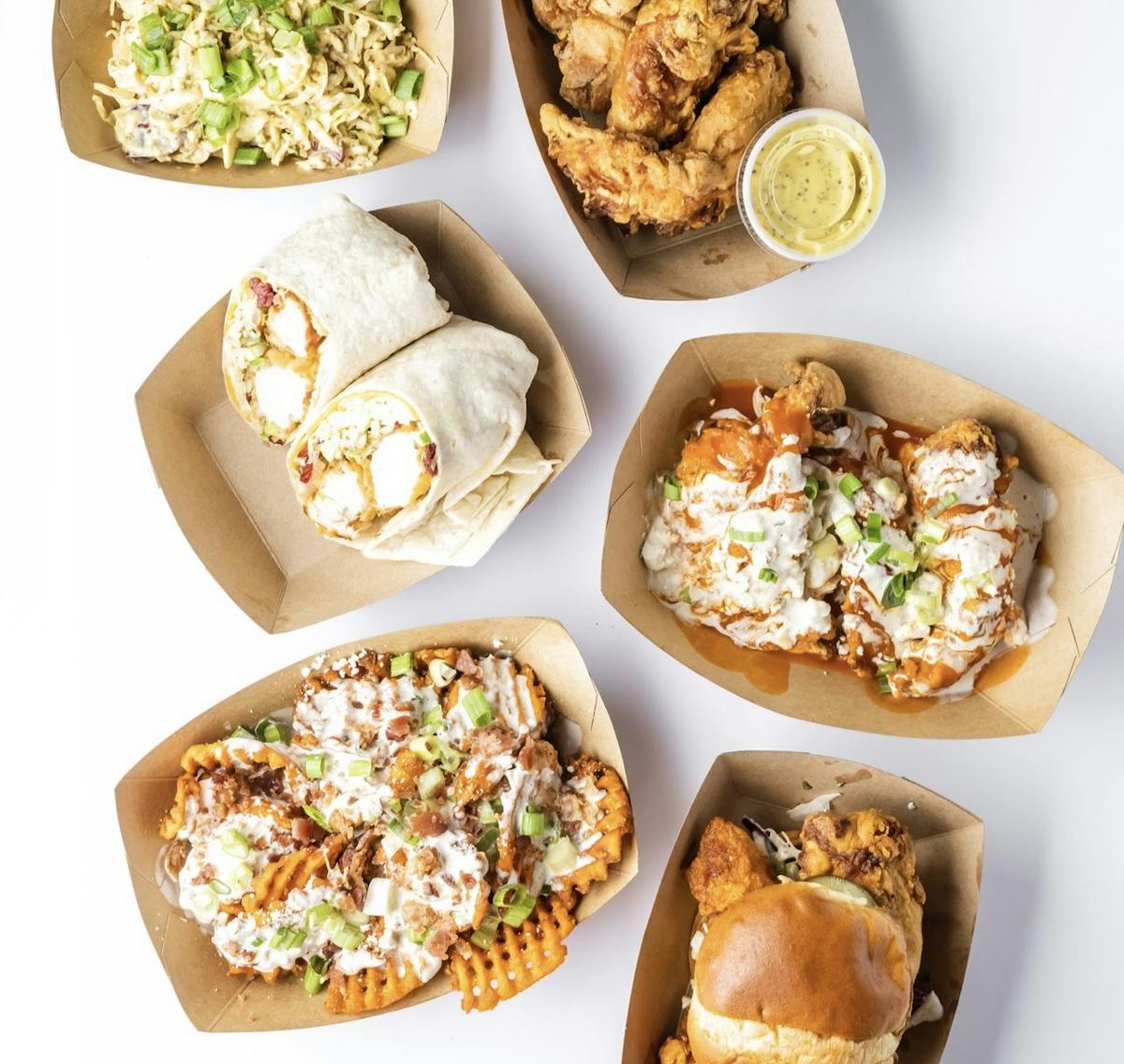 a box filled with different types of food on a plate