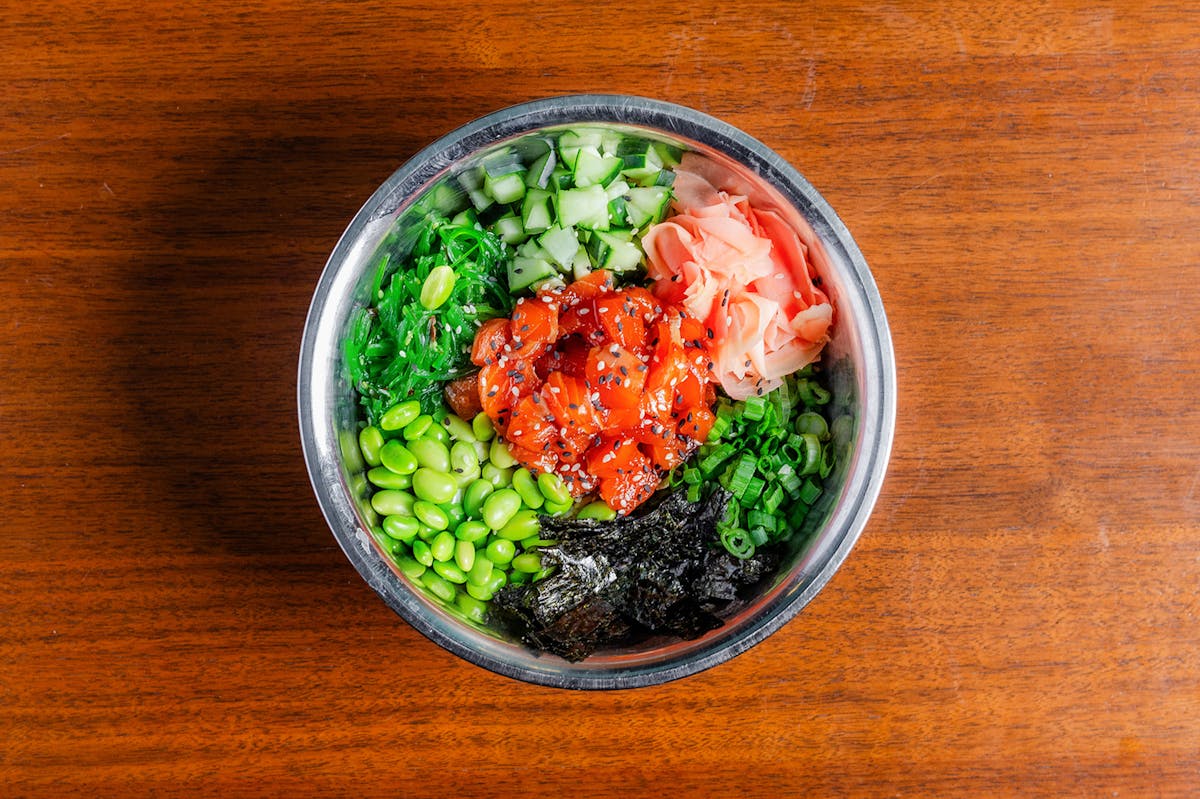a bowl of food with broccoli