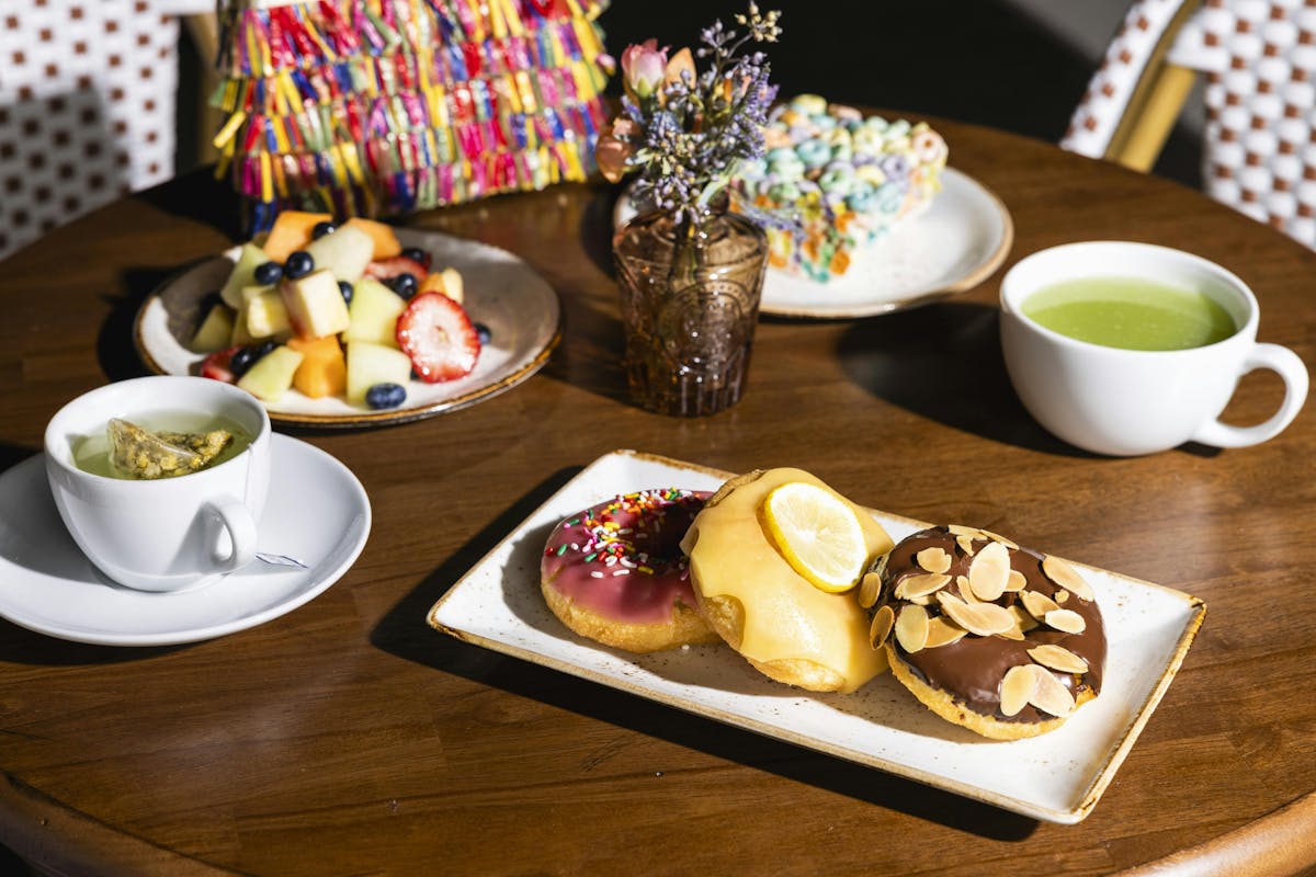 a plate of food and a cup of coffee on a table