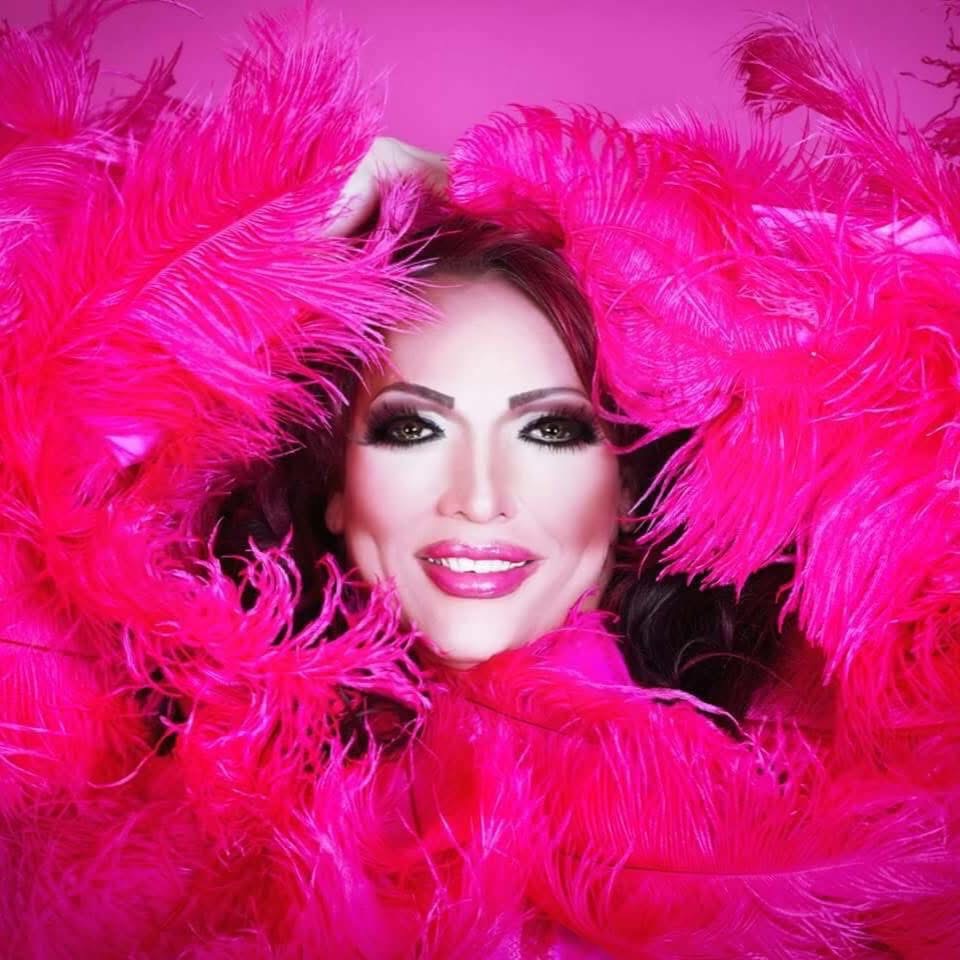 a woman with a pink feather boa