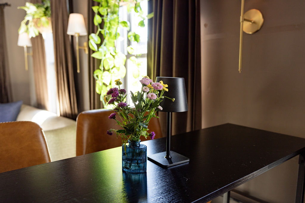 a vase of flowers on a table