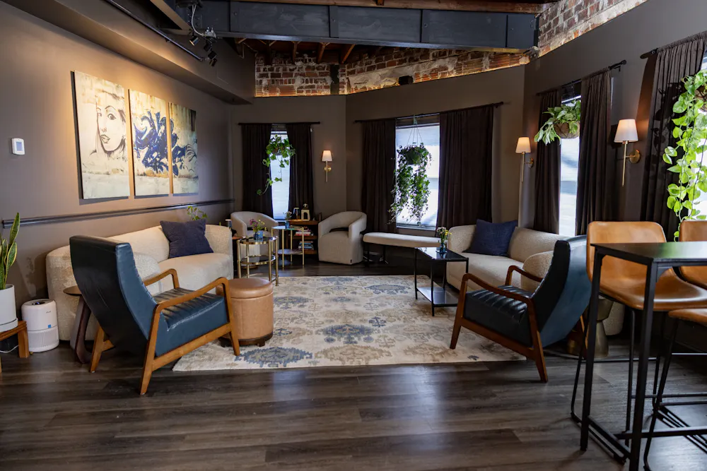 a room with couches and chairs