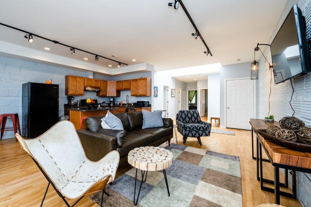 a living room filled with furniture and a fireplace