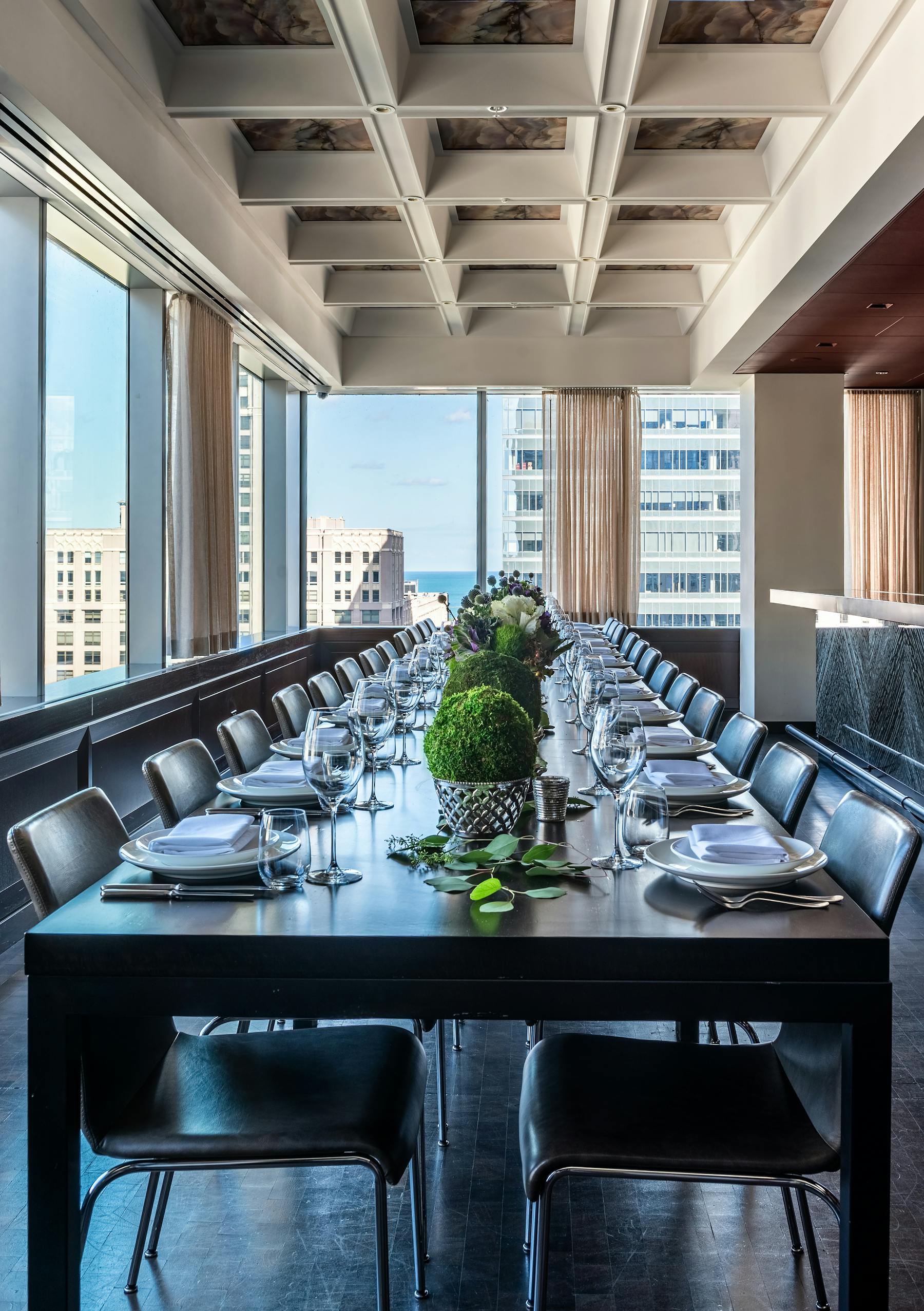 a dining room table in front of a window