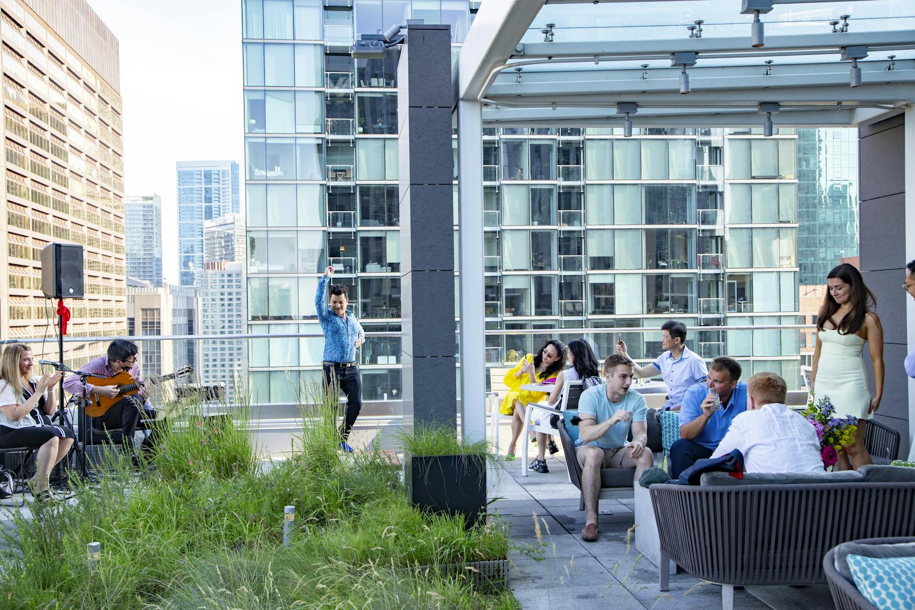 a group of people sitting on a bench in front of a building