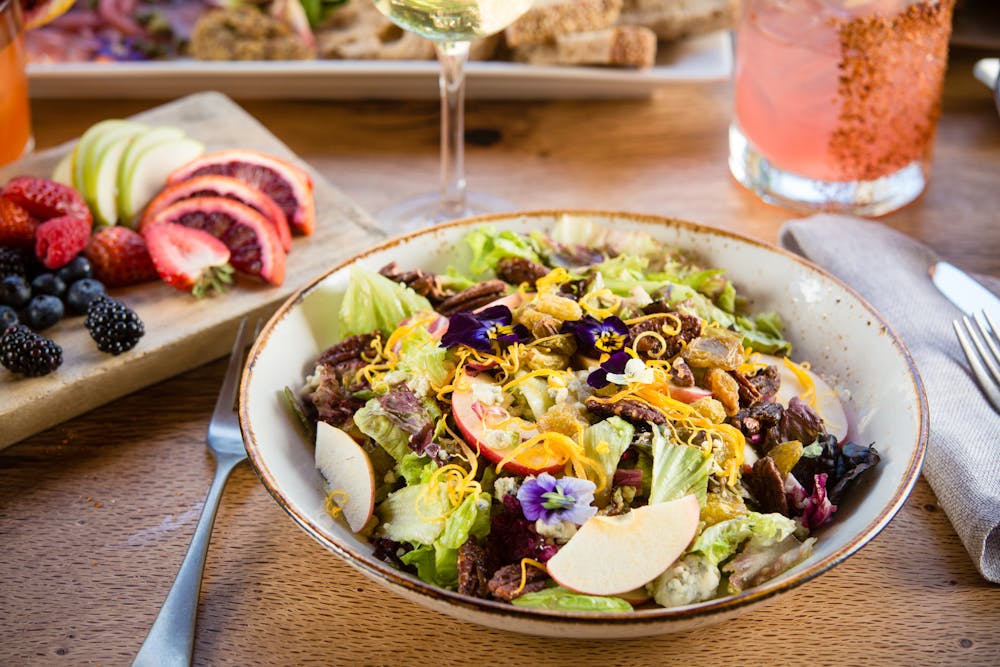 a plate full of food sitting on a table