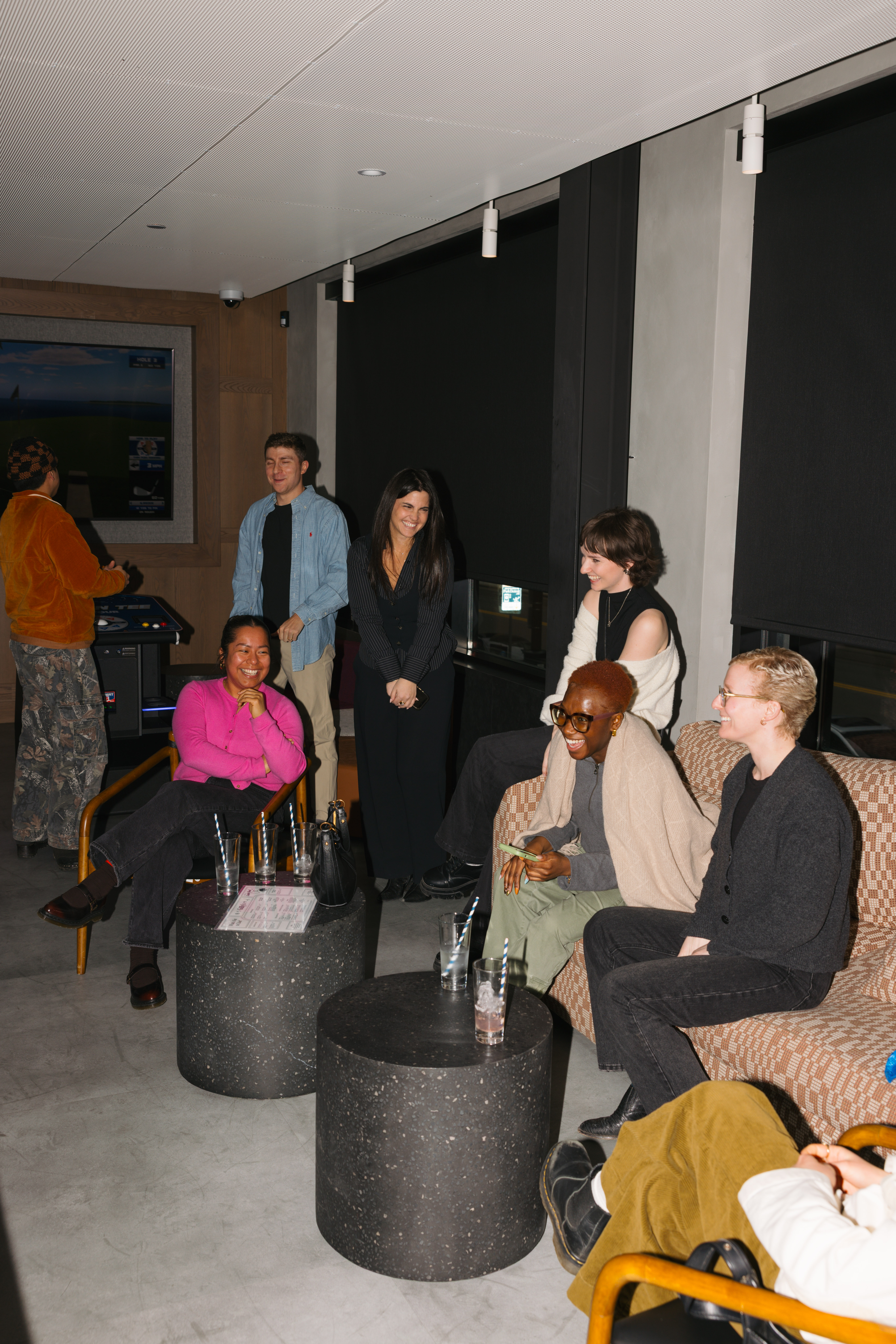 People in the box suite laughing together
