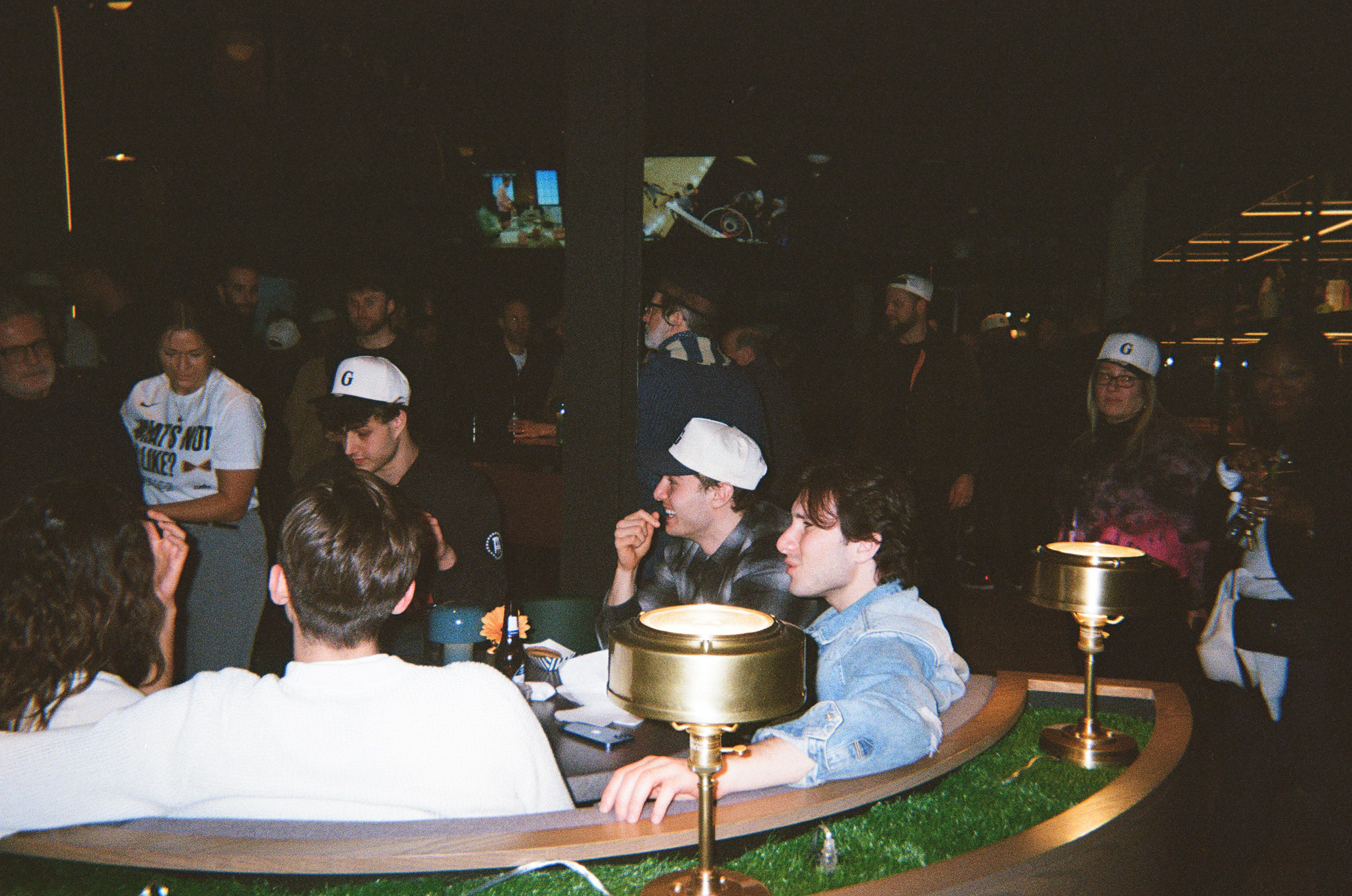 People sitting in booths on the first floor