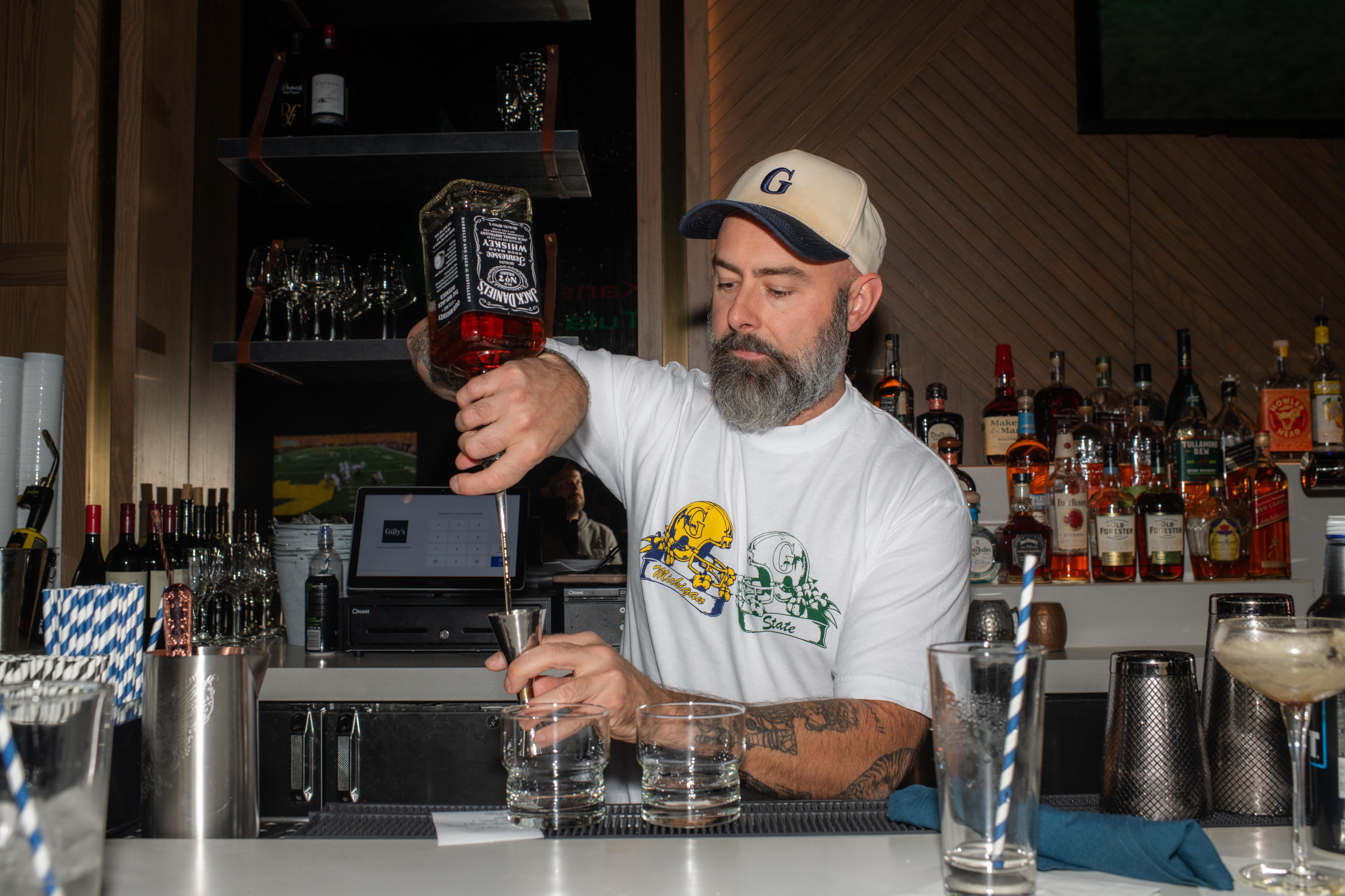 a man mixing drinks