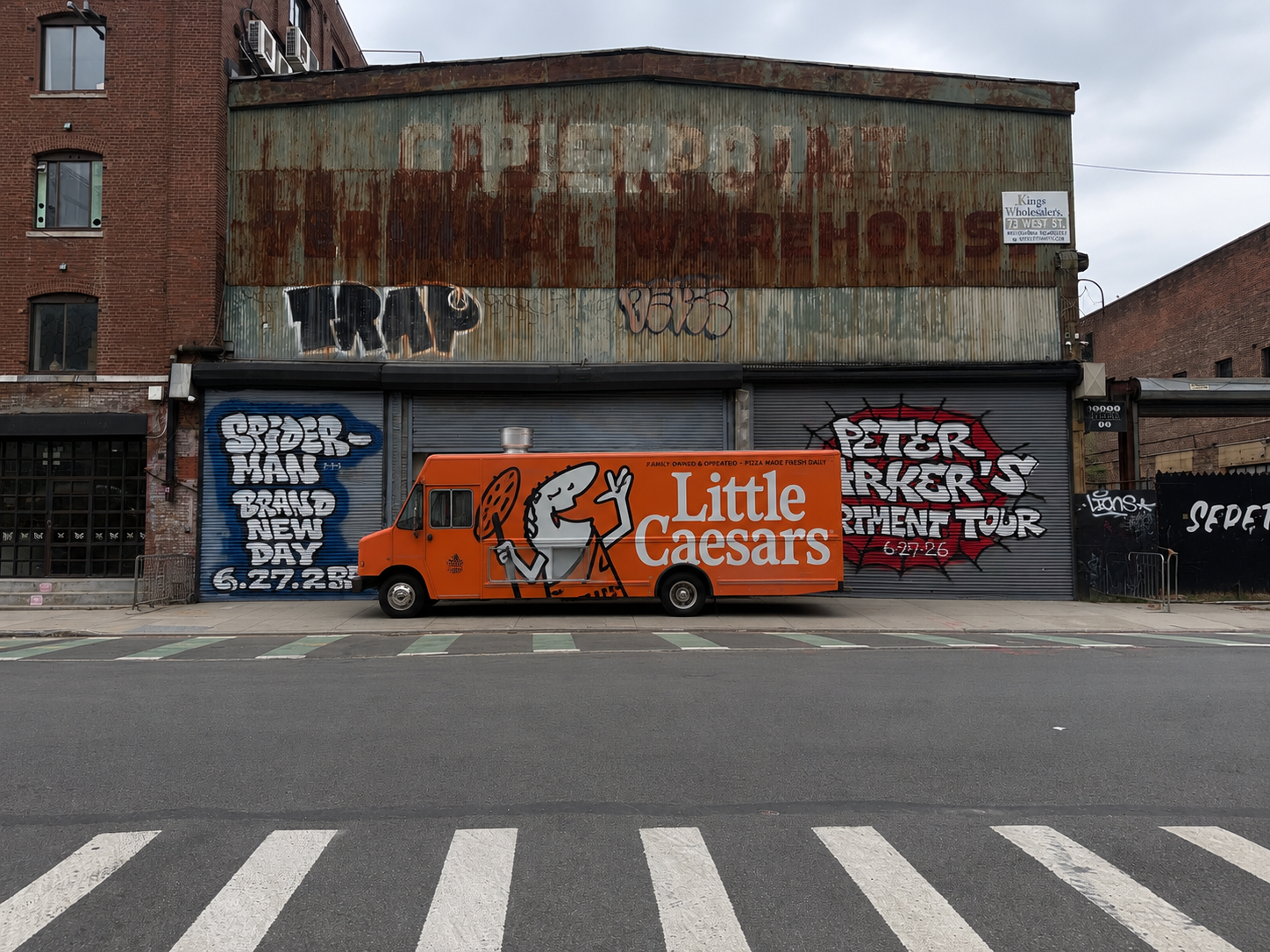an orange truck parked in front of a building