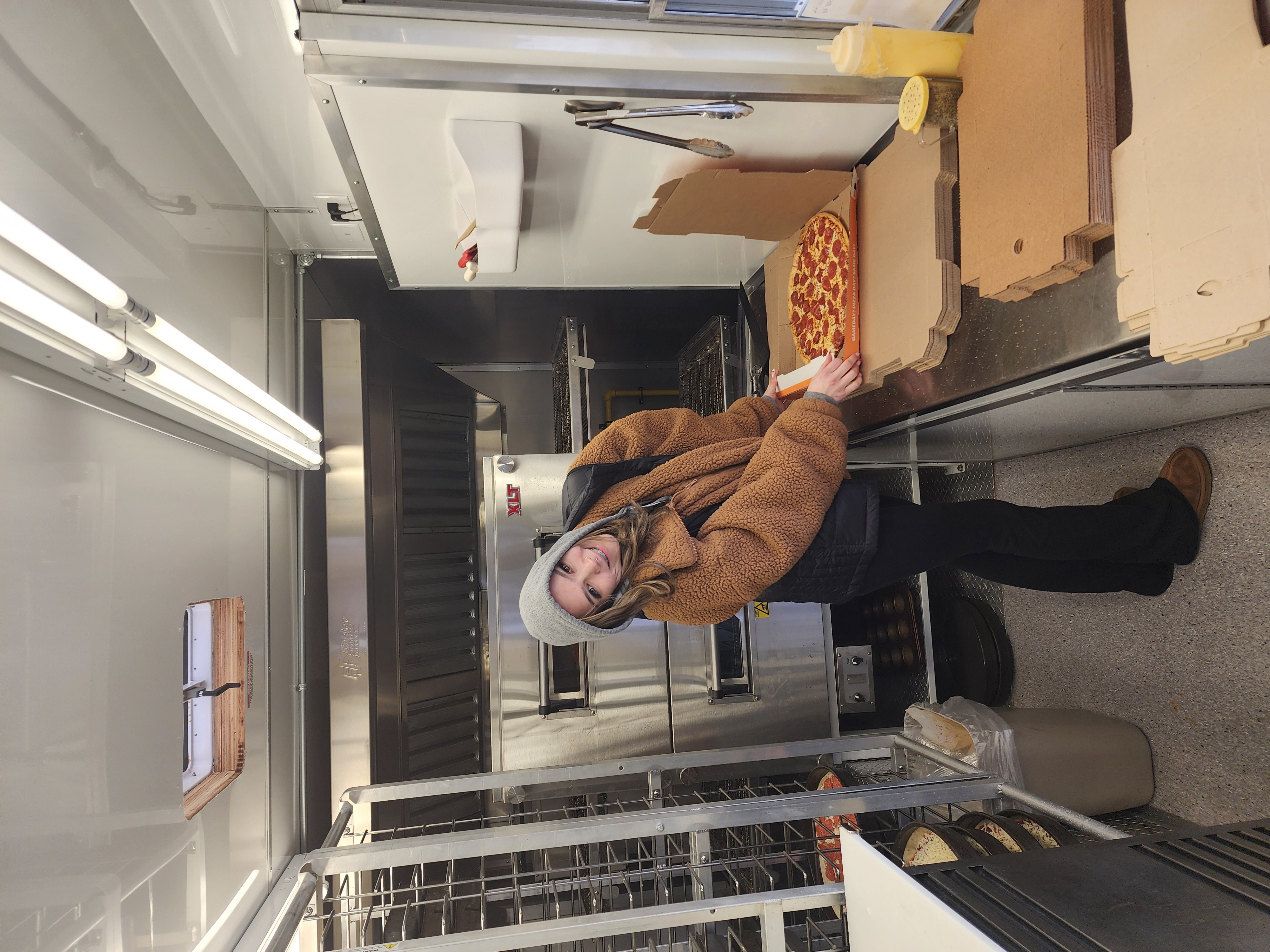 a person standing in a kitchen