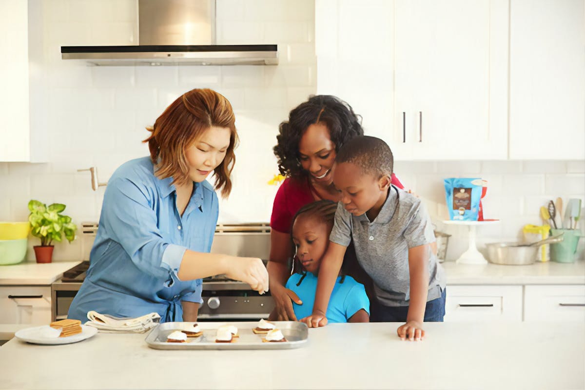 a woman standing in a kitchen