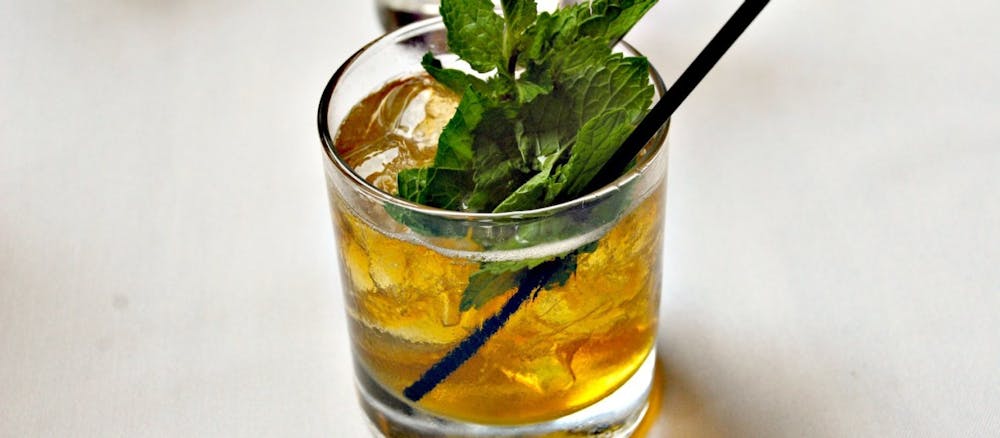 a close up of a glass of orange juice