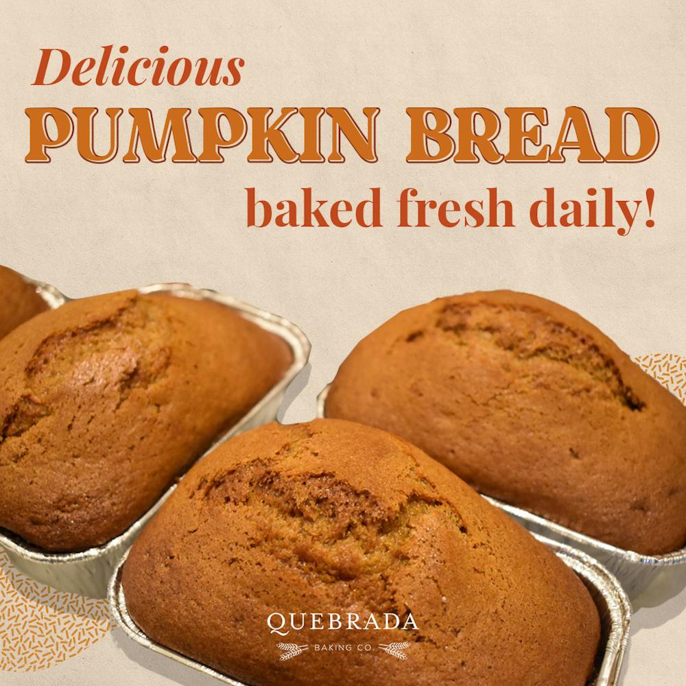 a sign above a box of donuts