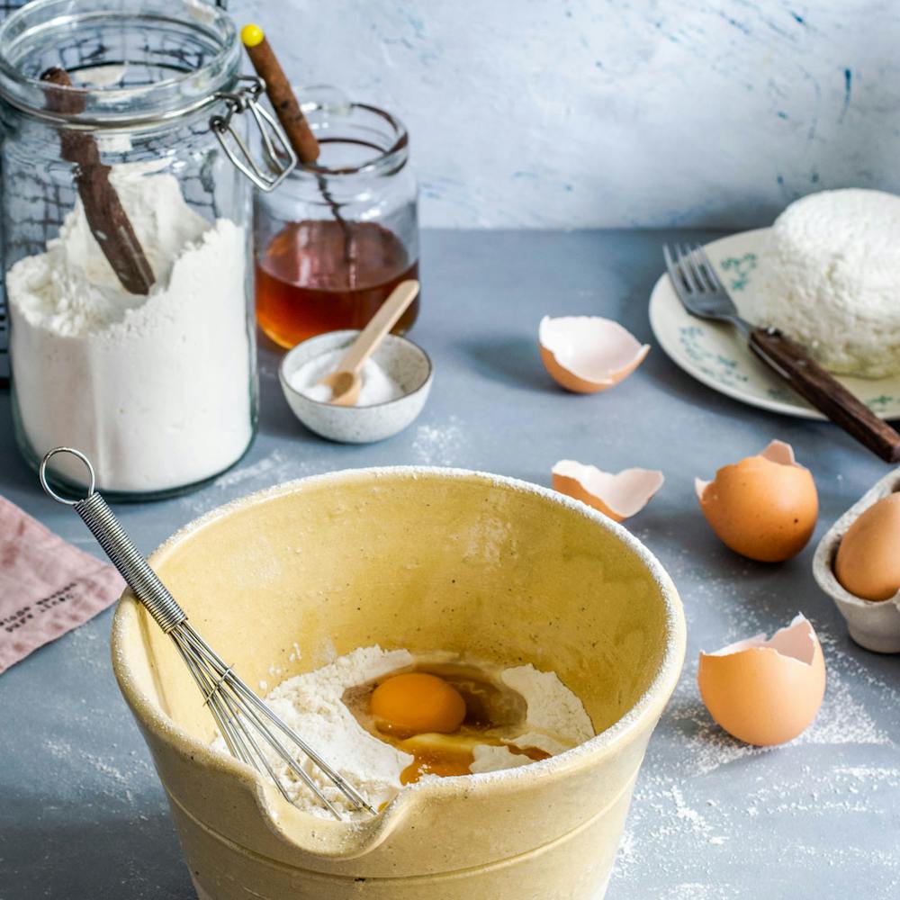 a plate of food and a cup of coffee