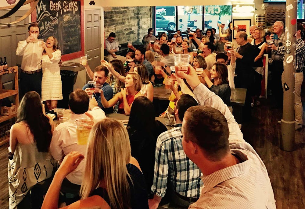 a group of people standing in front of a crowd