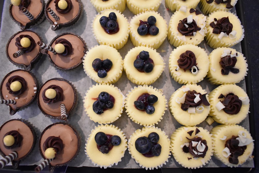 a large chocolate cake sitting on top of a metal rack
