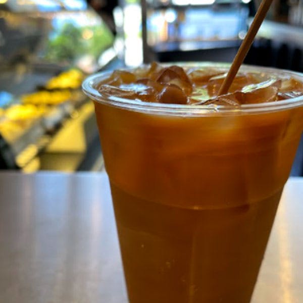 a close up of a glass of beer on a table