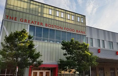 a sign in front of a building