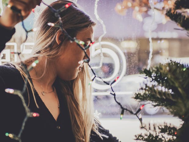 a woman looking at her cell phone