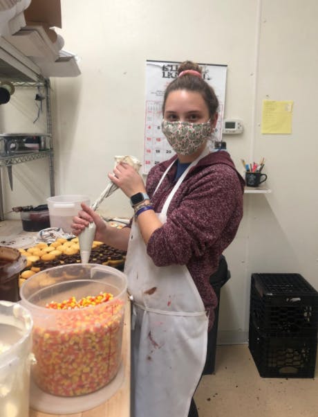 a person cooking food in a kitchen