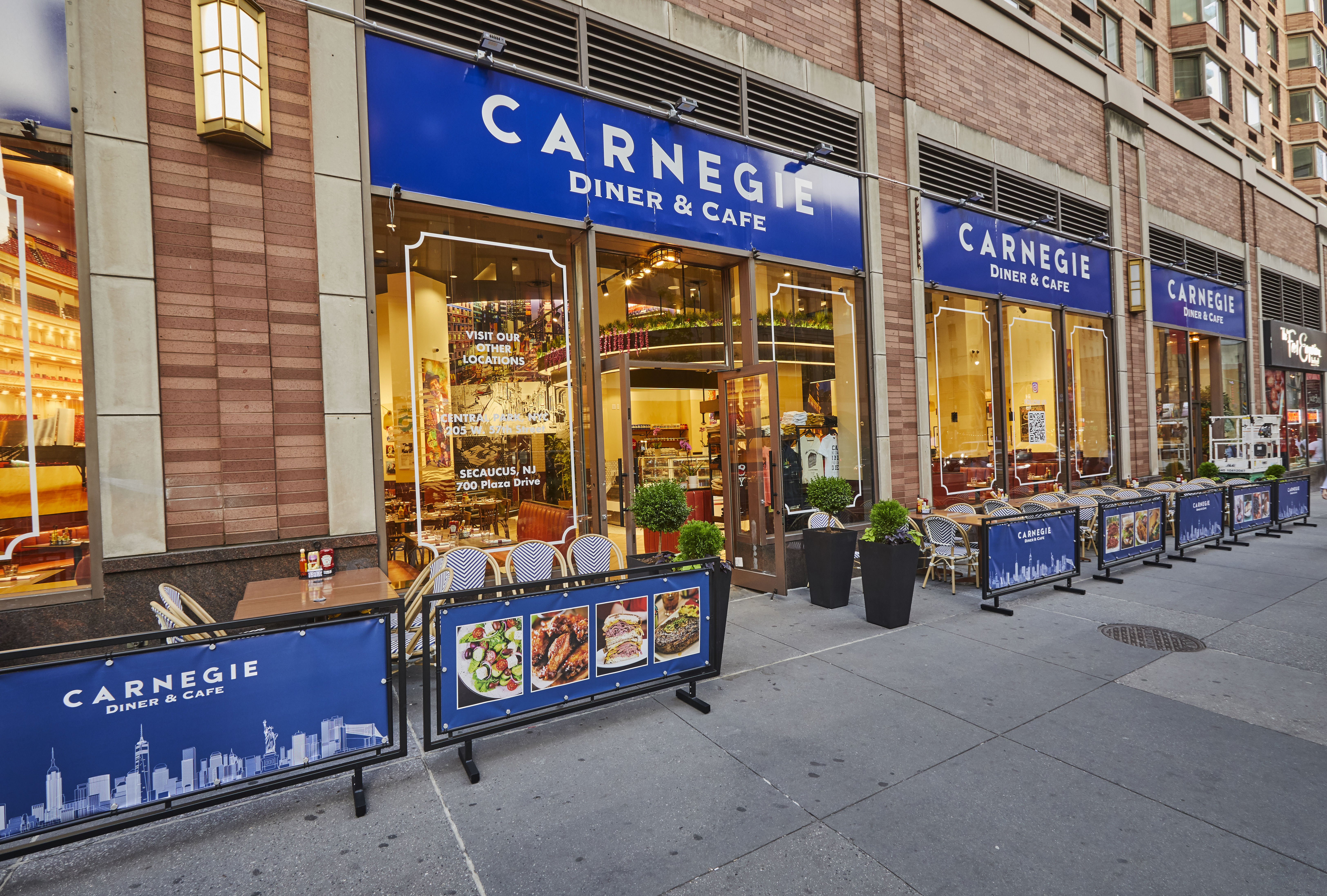 a restaurant with tables and chairs outside