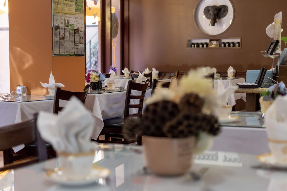 a person sitting at a table in a restaurant