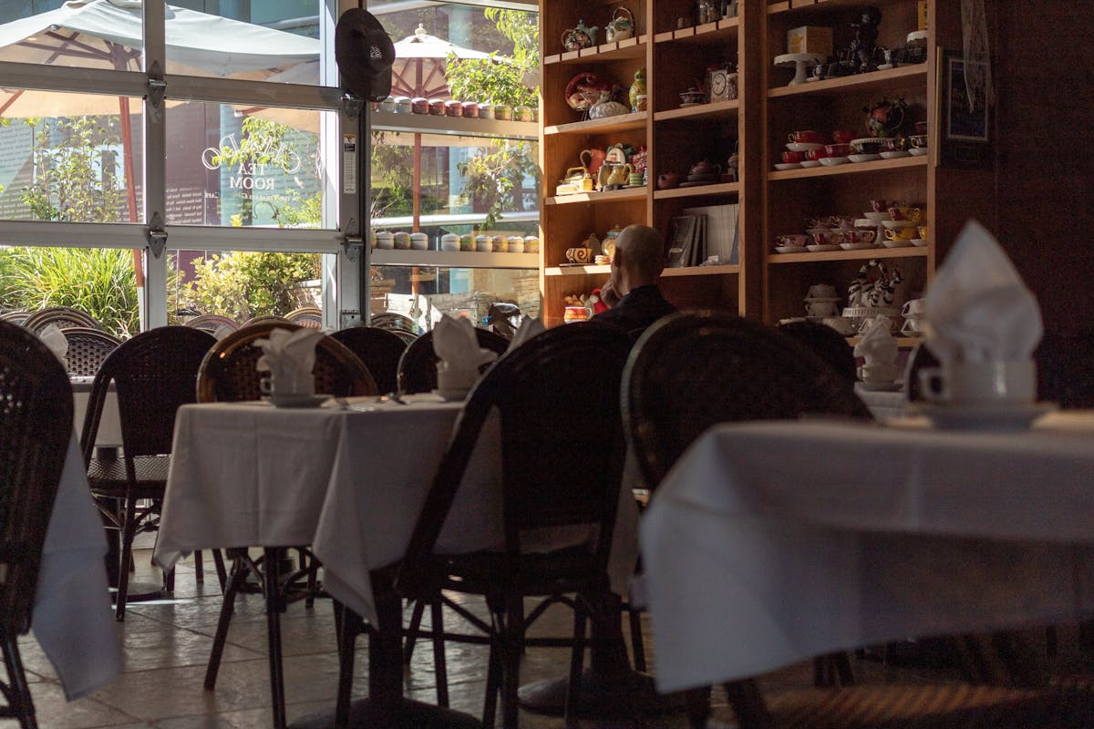 a dining room table in front of a window