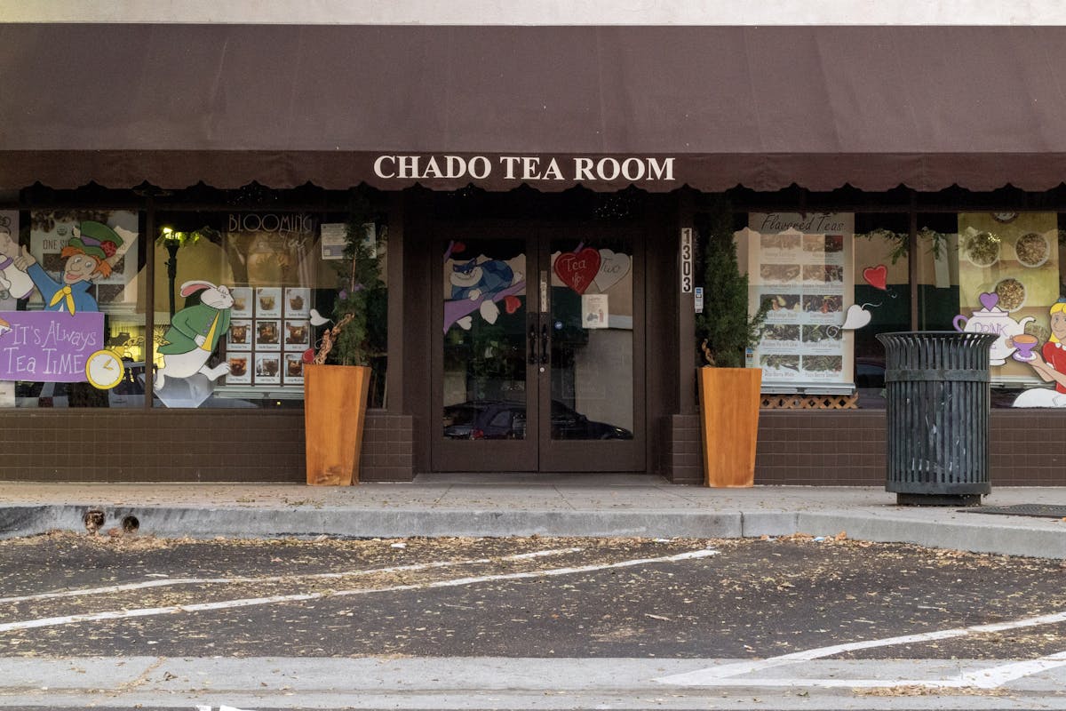 a building with a store on the side of a road