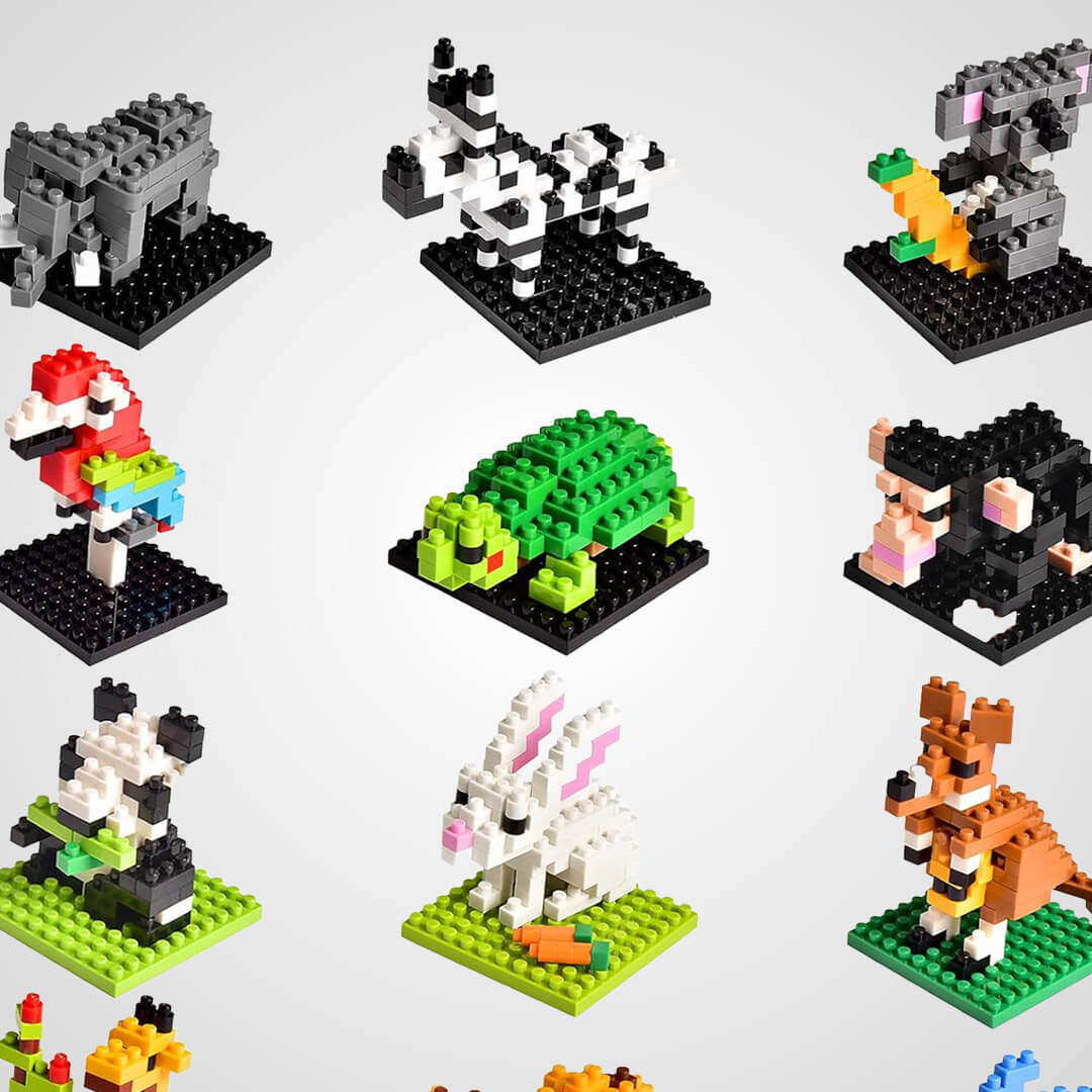 A collection of small toy animals constructed from miniature plastic building blocks, including a turtle, koala, zebra, and kangaroo.
