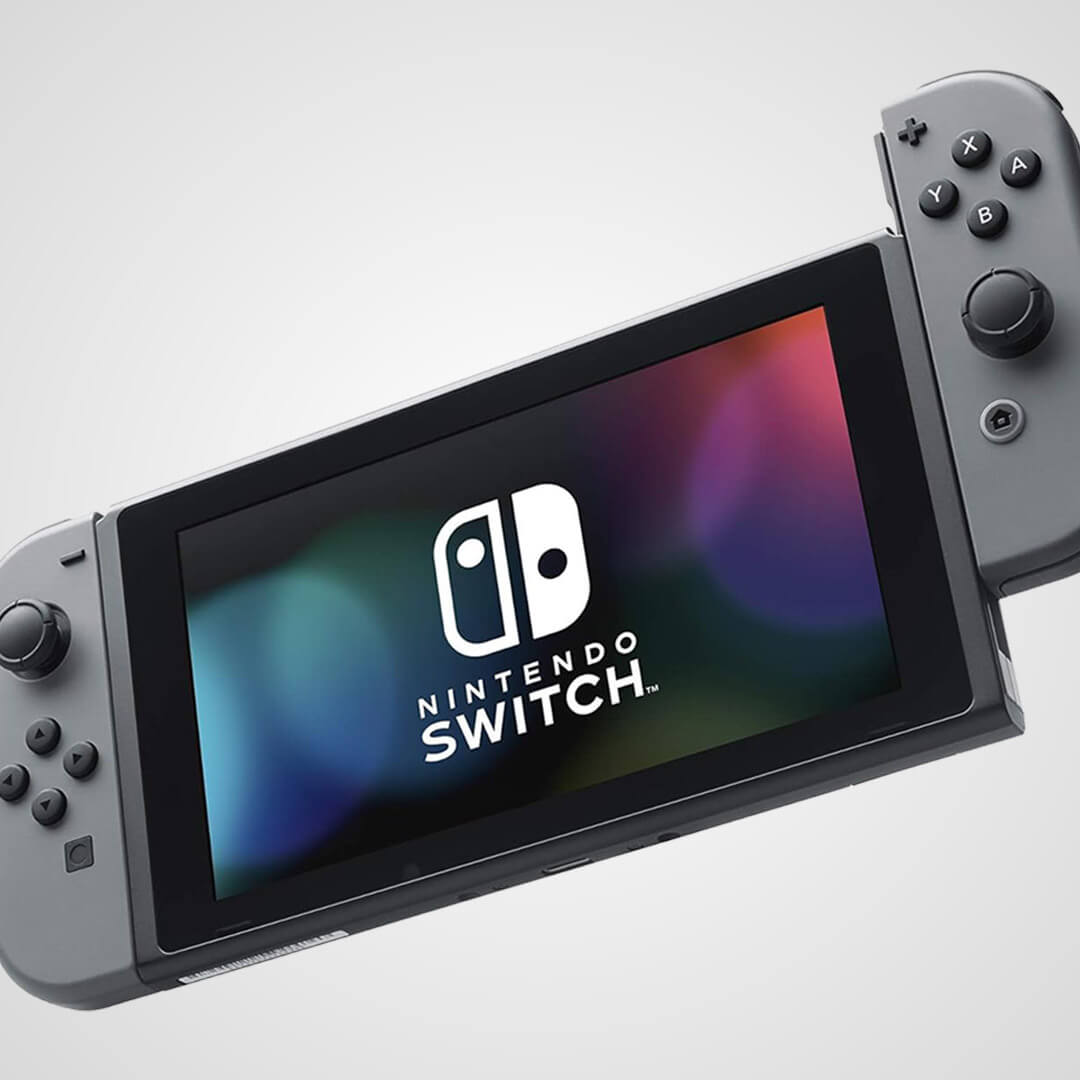 A grey Nintendo Switch hybrid video game console displaying its logo on the screen.
