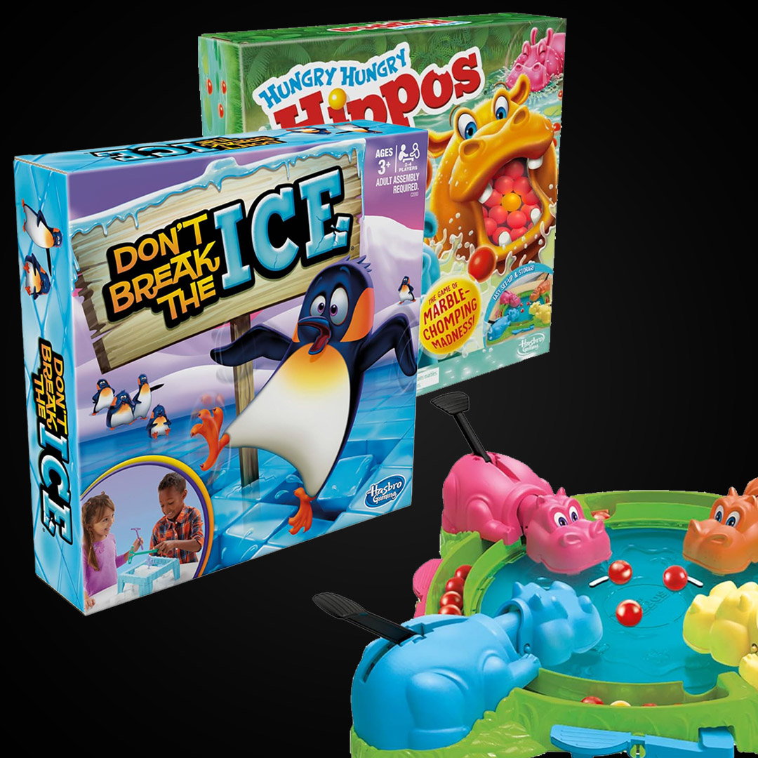 Retail boxes for classic children's board games Don't Break the Ice and Hungry Hungry Hippos, displayed with the plastic hippo game board.