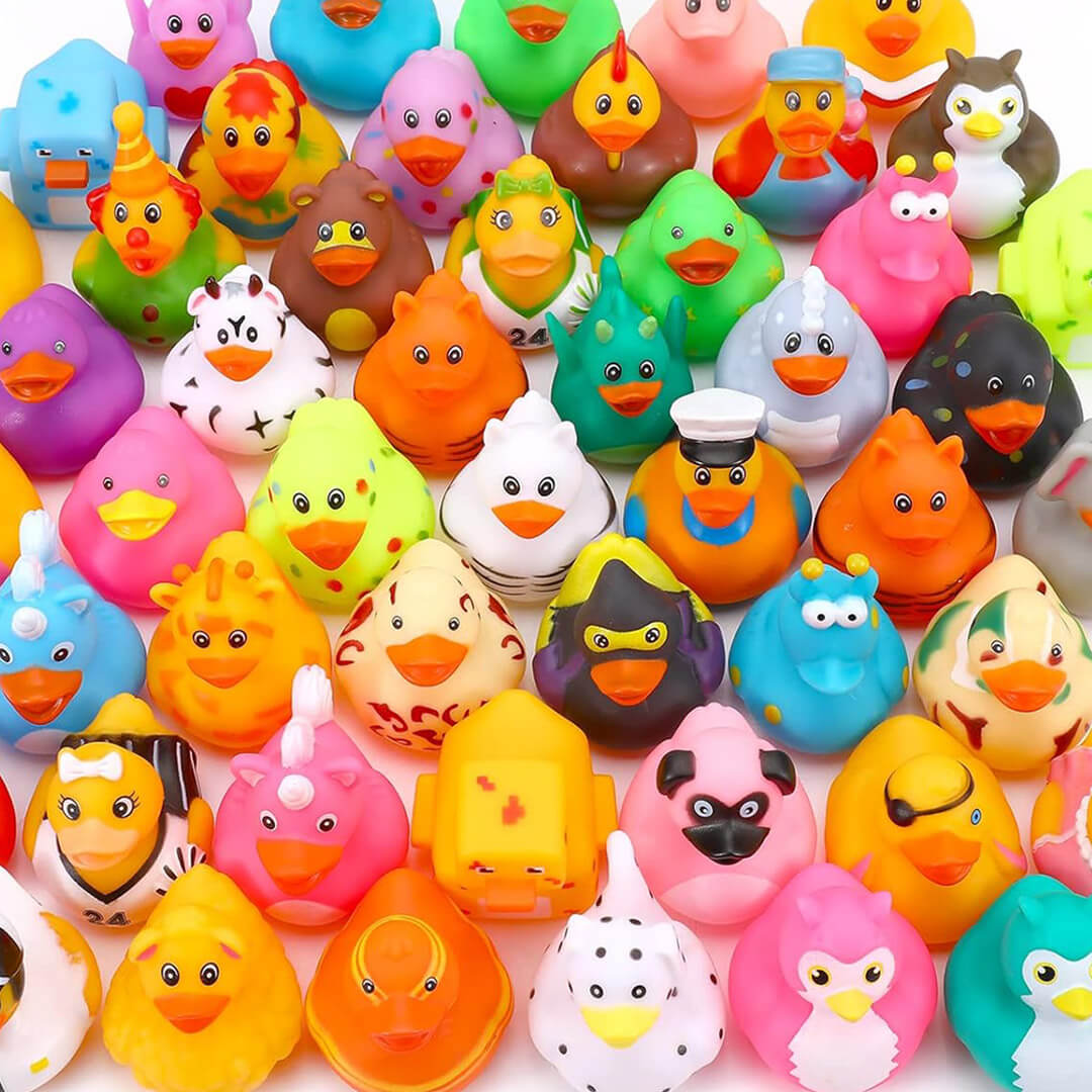 A large collection of novelty rubber ducks dressed in various themed costumes like a pirate, ninja, police officer, and superhero.