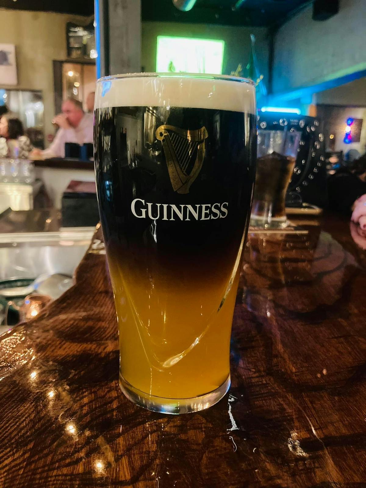 a glass of beer on a table