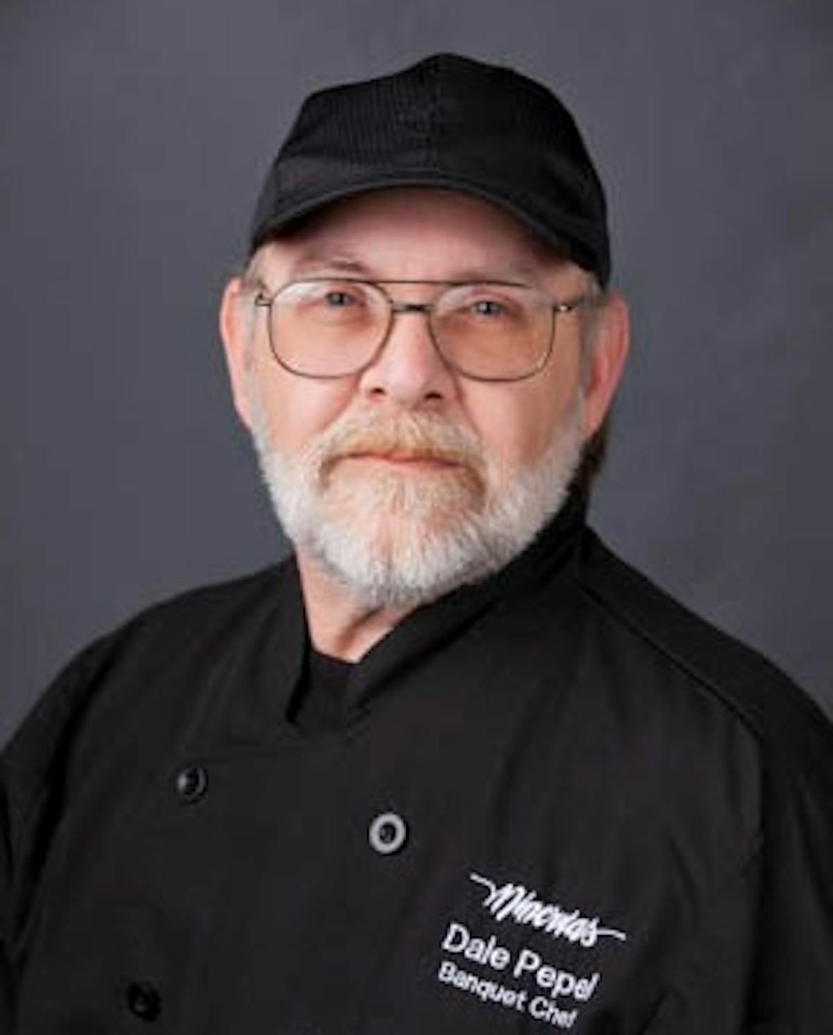 a man wearing a hat and glasses