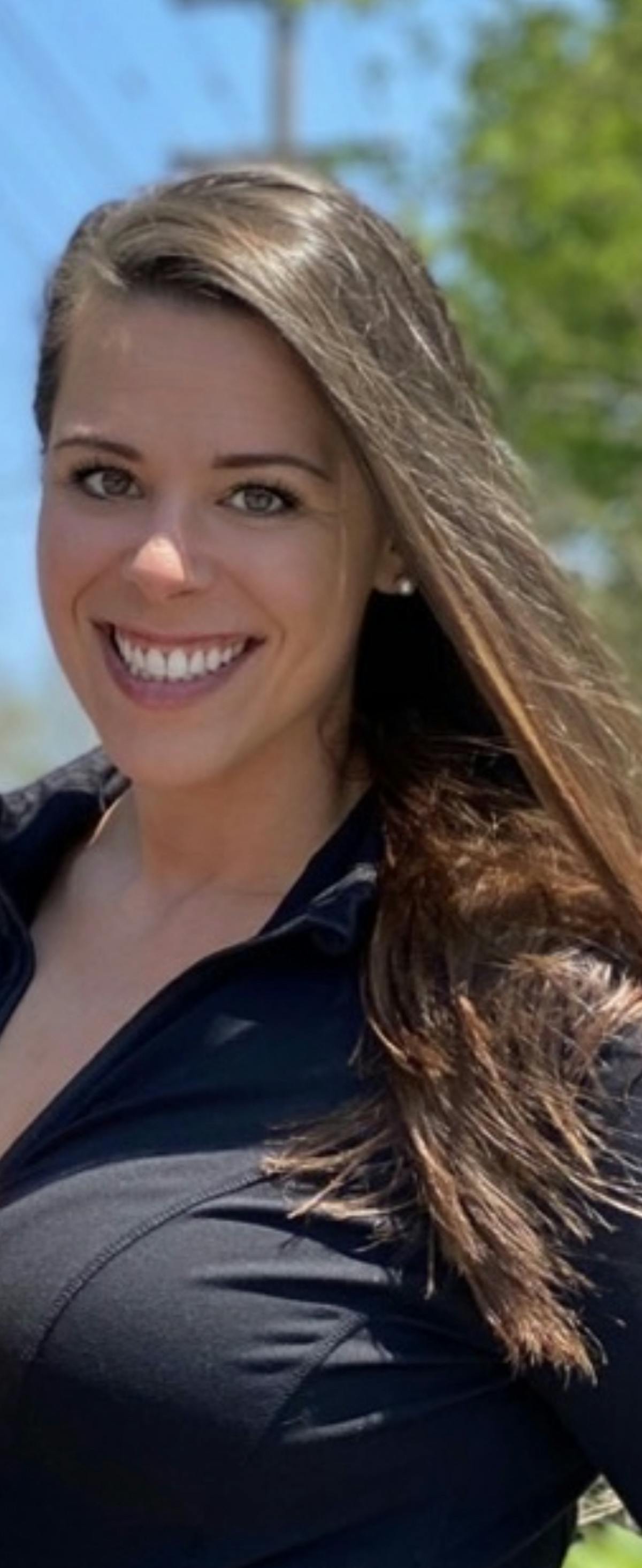 a woman smiling for the camera