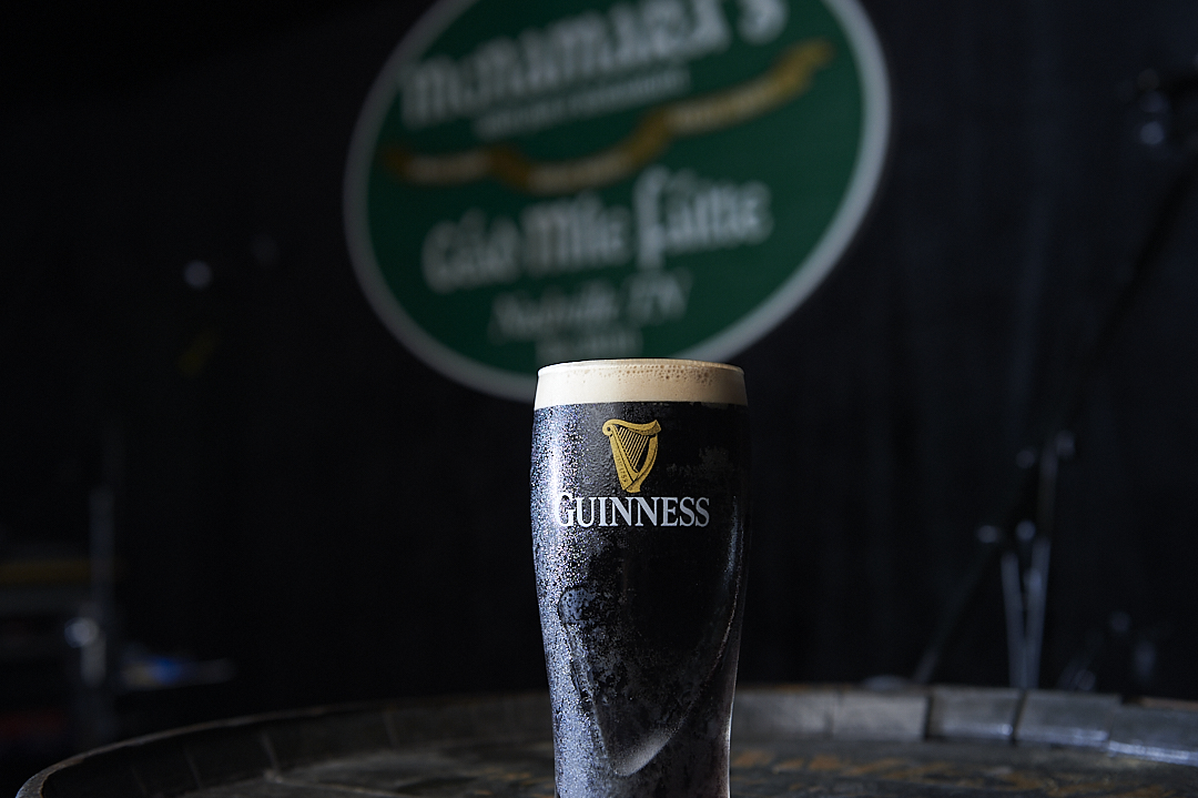 a glass of beer on a table