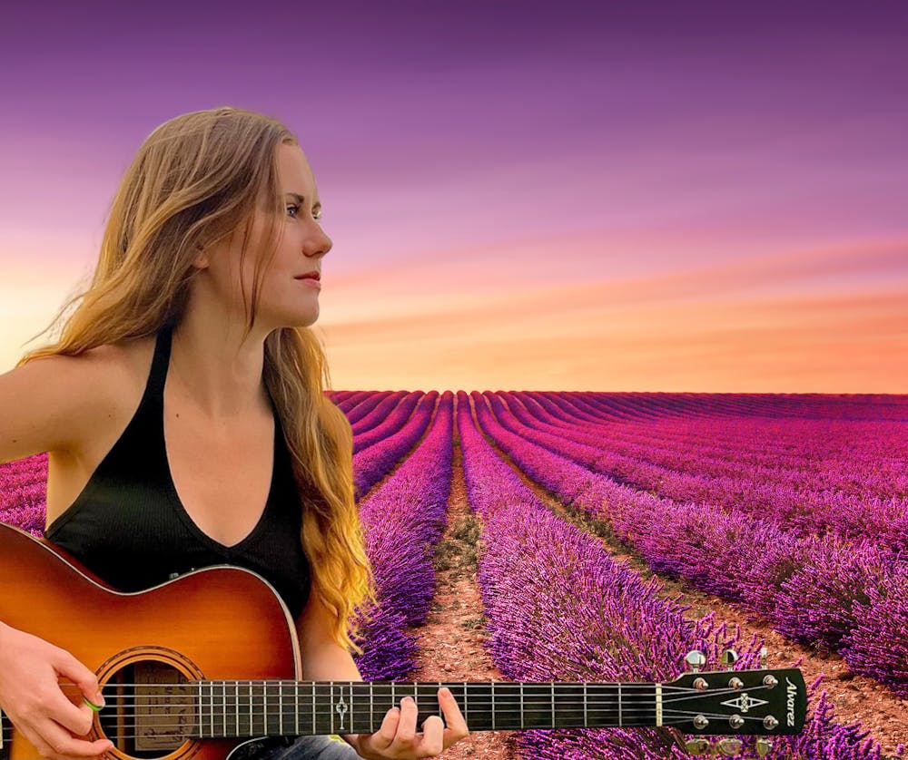 a woman holding a guitar