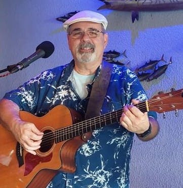 a man holding a guitar