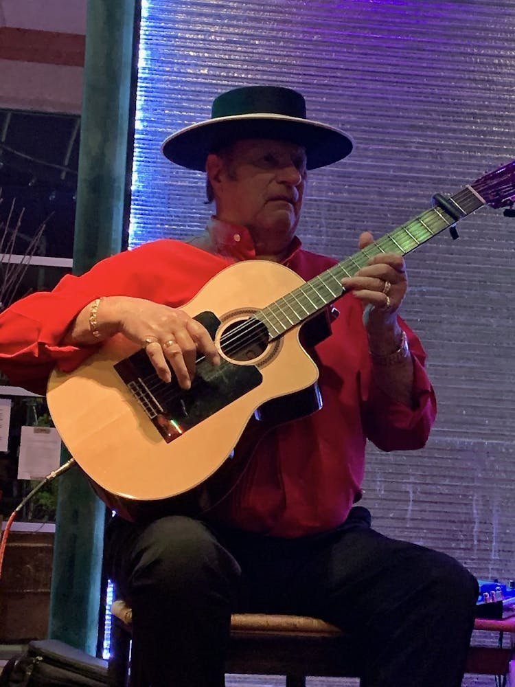 a man holding a guitar