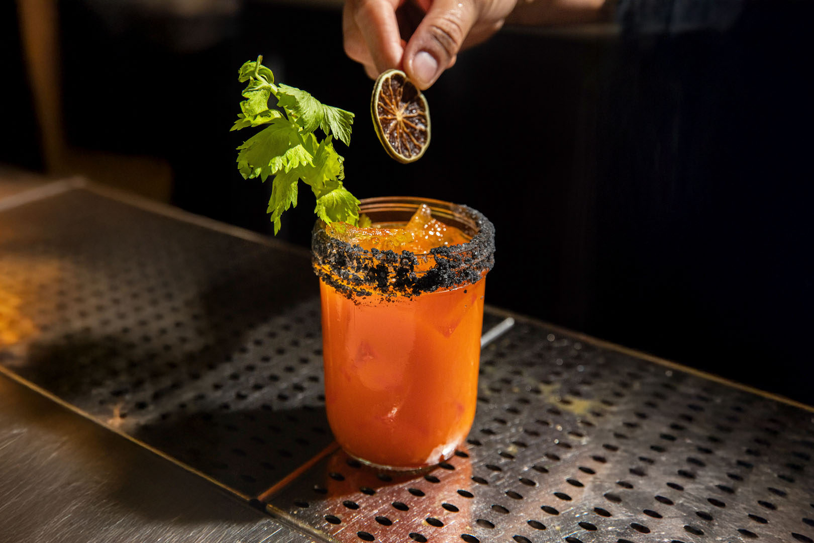 Blackened Swordfish, green rice and a glass of wine