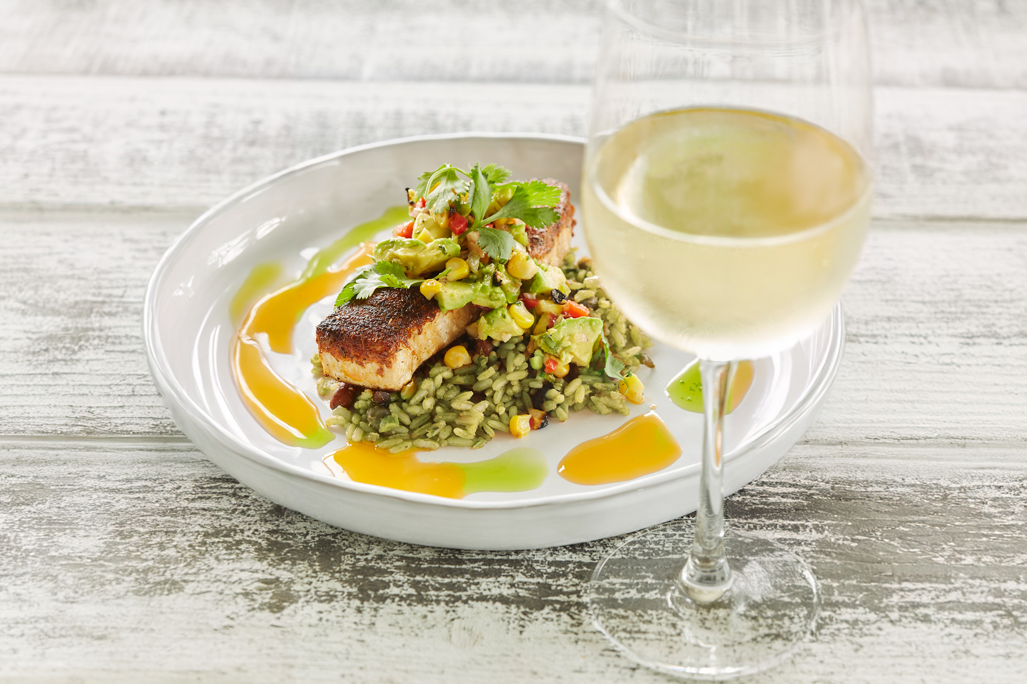 Blackened Swordfish, green rice and a glass of wine