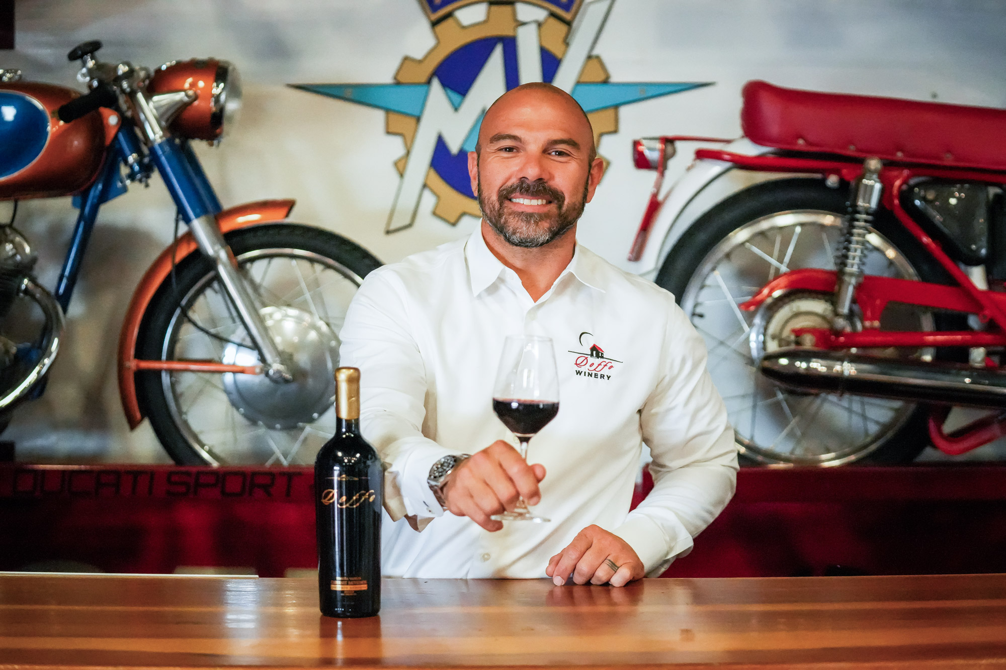 a man holding a glass of wine