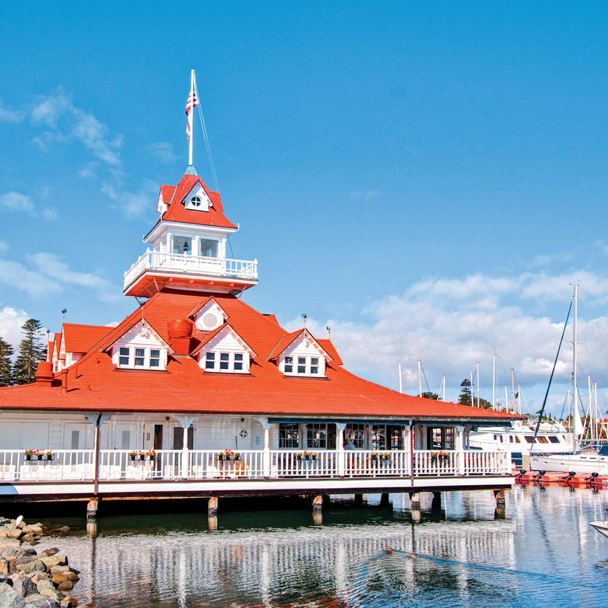 Bluewater Boathouse exterior on the water with boats in background