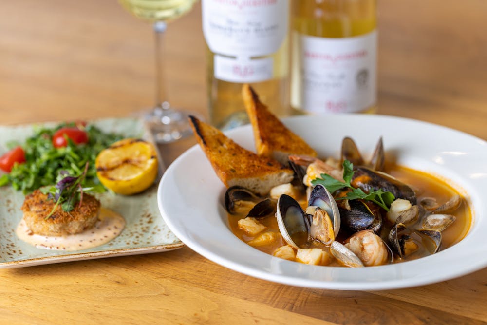 France's Bouillabaisse with Provencal style saffron infused broth, fresh fish, mussels, clams, shrimp and scallops, with rouille and Italy’s Cioppino in a zesty marinara sauce with clams, mussels, calamari, shrimp, scallops and fish