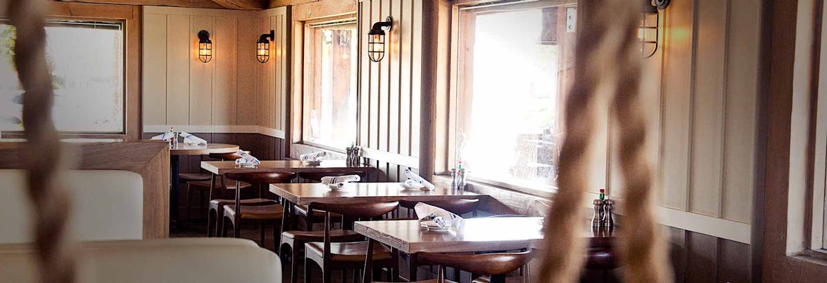 a dining room table in front of a window