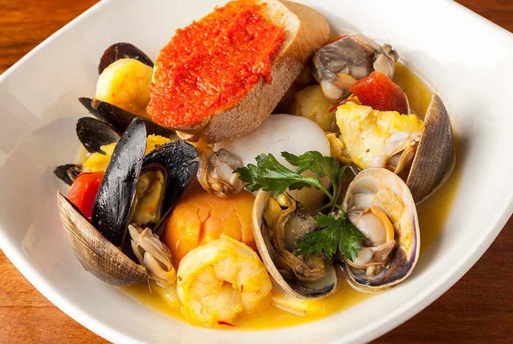 Italy’s Cioppino in a zesty marinara sauce with clams, mussels, calamari, shrimp, scallops and fish