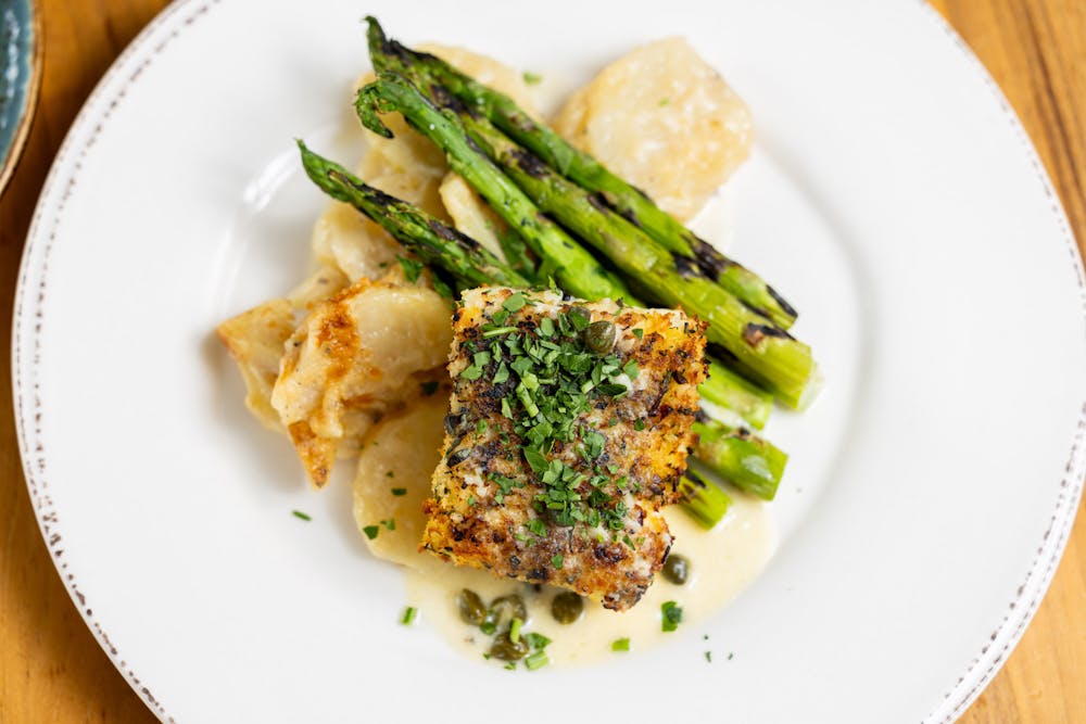 orange and walnut crusted with lemon caper butter served with scalloped potato and asparagus
