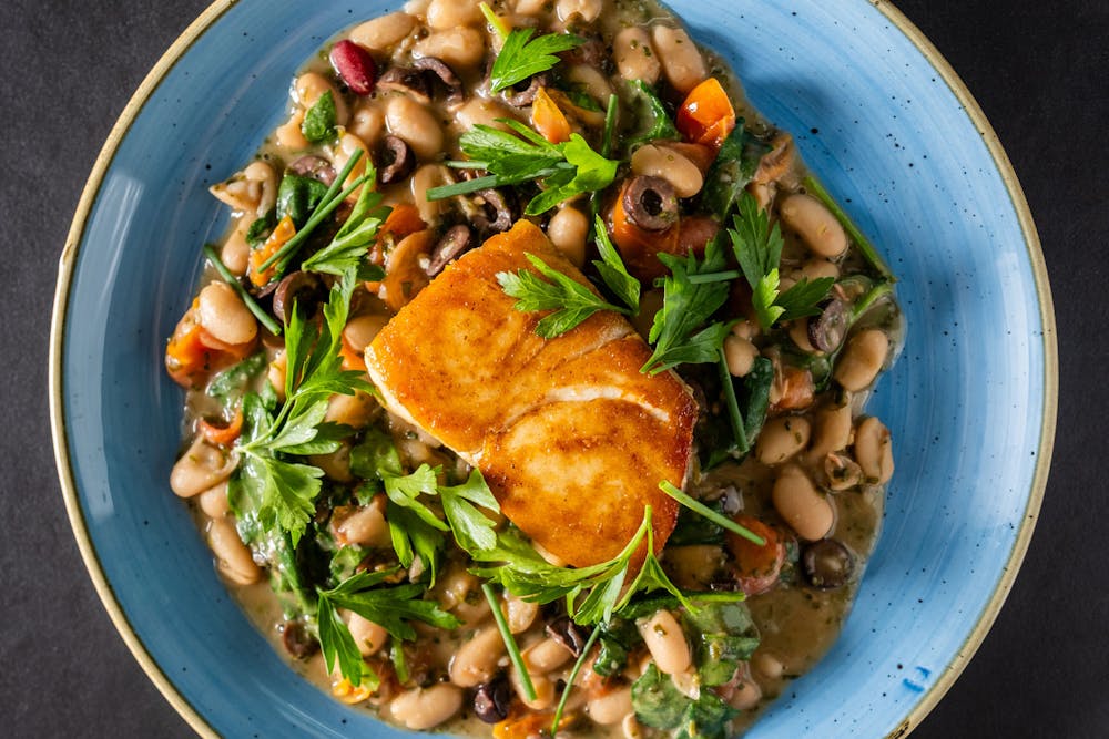 Blackened Swordfish, green rice and a glass of wine